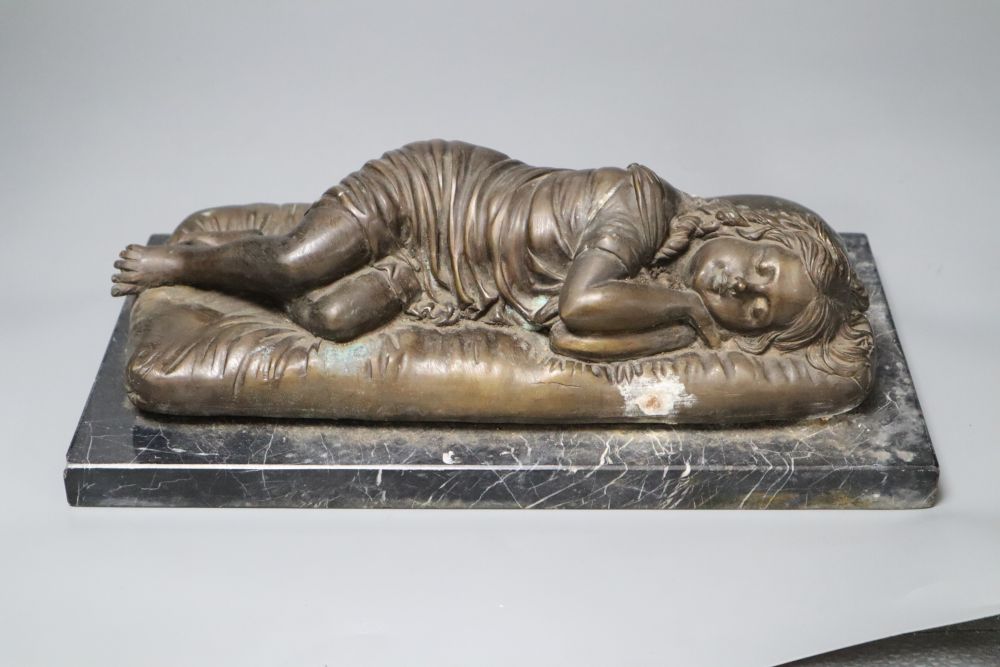 A bronze of a sleeping child